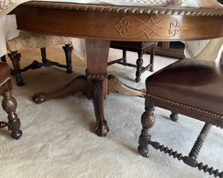 Antique centennial style mahogany carved pedestal table. 4 leaves