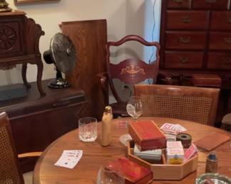 Vintage game table with four came back rolling chairs