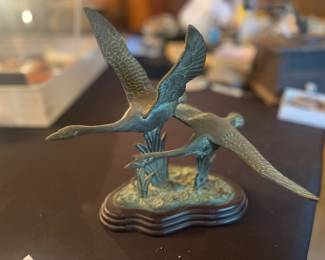 Bronze mallard duck in flight sculpture
