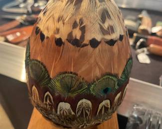 Peacock, feathered, covered egg sculpture