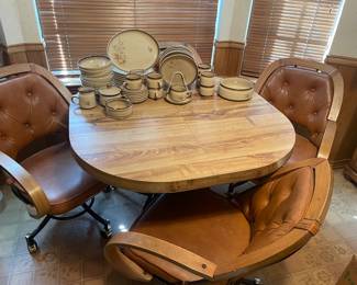 Mid-century modern dinette table with rolling chairs and one leaf