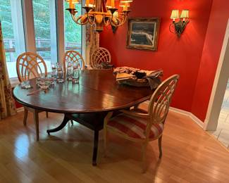 Another view of the dining table (round or oval with leaf) and dining armchairs 