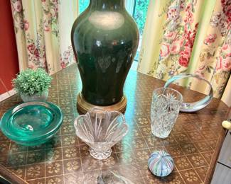 Another view of the square side table with iron base with hand-painted wood top, green table lamp (2 available), Kosta Boda  glass dish, large Petosky stone, Pottery vase, and more!