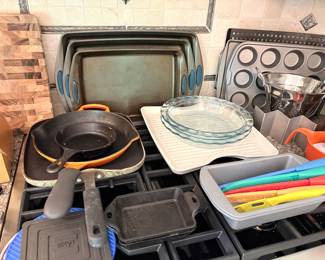 LeCreuset cast iron skillet, vintage small cast iron skillet and square pans, pyrex, baking pans, and Cuisinart ceramic knives
