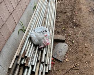 Poles and roles of fence and gate and caps all for $100.00