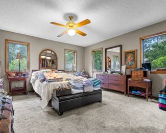 The Master Bedroom, including the Kent Coffee Mid-Century Modern Bedroom Set, Quilts, Branded Clothing, Scarves & Purses.  Photo by: Ginger Snapper Photography.
