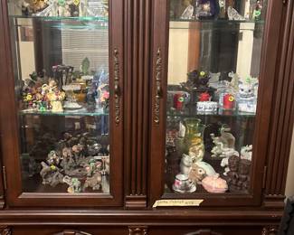 Beautiful antique curio with an assortment of figurines