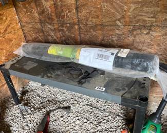 STORAGE SHELF AND ROLL OF GARDEN MESH