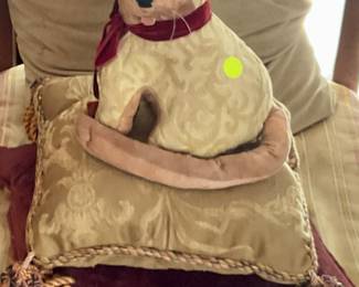 Vintage stuffed dog on pillow