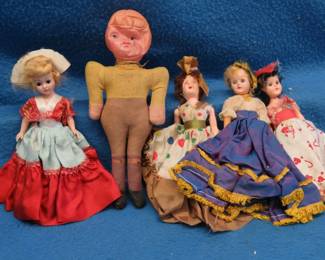 Lot 52. Four vintage sleepy eye Bakelite (?) Dolls and a old football player doll