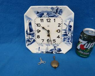 Lot 116. Delft German kitchen clock for parts or repair. Includes key and pendulum.