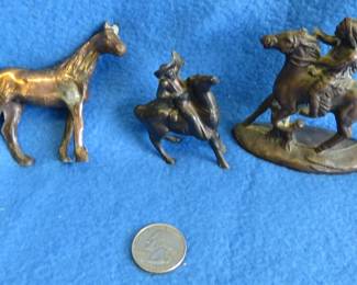 Lot 244. Cast iron cowboy and Indian figurines