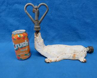 Lot 315. Antique cast iron lawn sprinkler in the form of an alligator. Unknown maker.