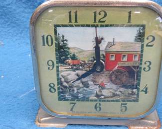 Lot 56. Lux wind-up stream and (non-turning) watermill animated alarm clock. Both clock and alarm work.