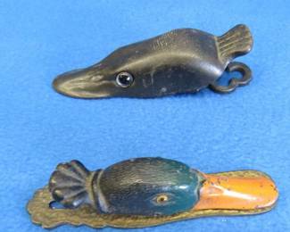Lot 211. Old cast-iron northern pike and mallard paper clips with glass eyes