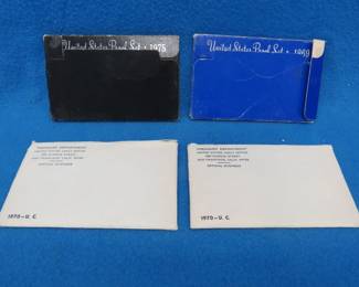 Lot 144. Two 1970 US Mint Uncirculated sets (one is unopened), a 1969 Proof set, and a 1975 Proof set