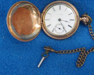 Lot 17. 1883 gold watch with chain and key: Sold by Illinois Watch Co. Keystone 20-year gold filled case #6872028. Currier 13-jewel movement #3336572. For parts or repair