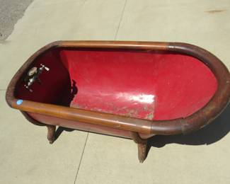 Lot 63. Antique Cowboy metal bathtub with wooden trim. About 50 Lbs.