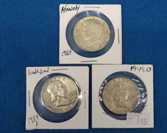 Lot 37. Two Franklin and one Kennedy half-dollars