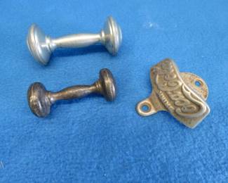 Lot 212. Vintage metal baby rattles and a Coca-Cola bottle opener