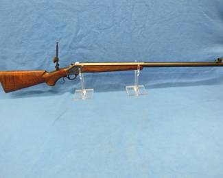 Lot 206. Browning Model 1885 45-70 single shot breech loading rifle. SN 7020NT2B7. Miroku mfg. includes globe front sight, aperture rear micrometer sight, and more.