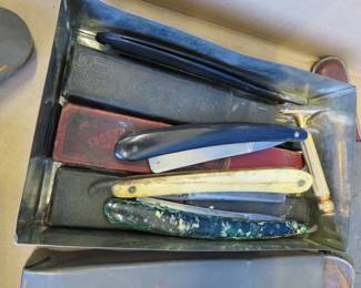 Lot 254. Metal box with many vintage straight-edge razors