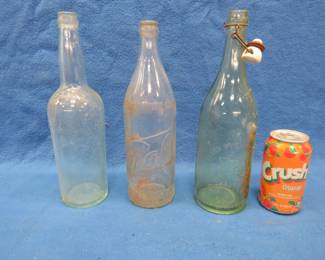 Lot 357. Three large glass beer bottles. Old Style, Graf, and Gluek's. No chips.