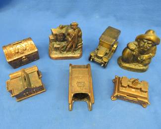 Lot 22. Seven collectible metal banks