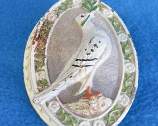 Lot 198. Cast iron dove door knocker, numbered 616
