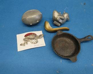 Lot 55. Candy molds, cast iron ashtray, Marine Corps pin