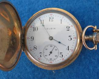 Lot 209. 1912 working Elgin watch with chain. 25 year Keystone J. Boss gold filled case # 7596471. Elgin 15 jewel works #16144309. Chain is 14 KT gold-filled.