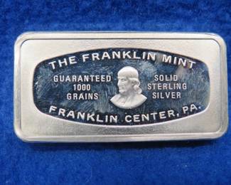 Lot 384. Franklin Mint Bank-marked sterling silver ingot. 65.16 grams.