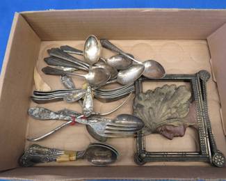 Lot 249. Silverplate silverware from different makers and a pair of cast Native American book ends