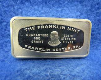 Lot 386. Franklin Mint Bank-marked sterling silver ingot. 65.21 grams.