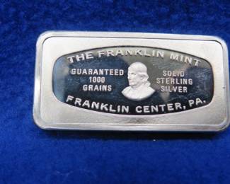 Lot 389. Franklin Mint Bank-marked sterling silver ingot. 65.34 grams.