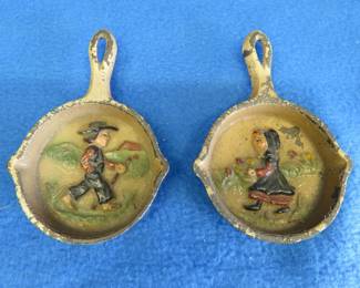 Lot 223. Miniature cast iron skillets with embossed hand-painted scenes