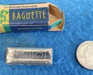 Lot 57. Borrah Minevitch Baguette 1 3/8" miniature harmonica.