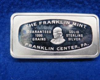 Lot 383. Franklin Mint Bank-marked sterling silver ingot. 65.75 grams.