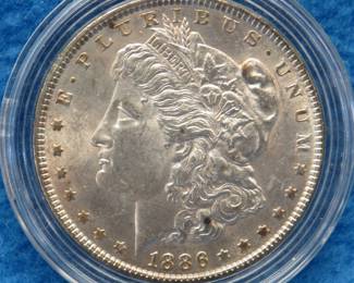 Lot 175. 1886 P Morgan silver dollar from a boxed set. All coins from this set are being sold individually in this auction.