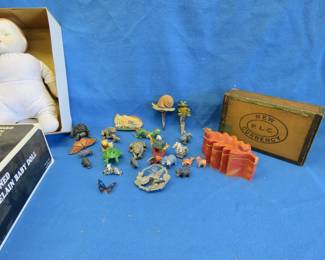 Lot 299. Porcelain Baby Doll. Vintage cigar box. Garden animal stakes and more.