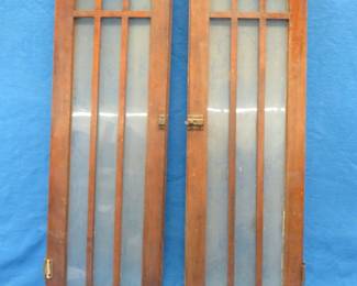 Lot 329. Mission-style oak doors for a built-in cabinet. 41 1/2" x 12". Good condition with all glass intact.