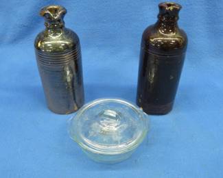 Lot 196. Two stoneware cruets and a small serving dish