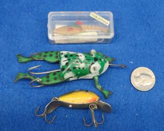 Lot 393. Shakespeare 1 3/8" wooden Dopey, Harrelson Tackle Co. 1" Vivif made in France with a box and papers, and a Halik Frog made in Moose Lake, Minnesota.