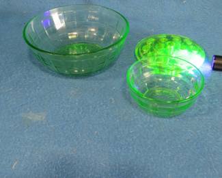 Lot 51. Uranium glass. Flower frog and two Anchor Hocking bowls. Large bowl has a small chip.