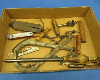 Lot 182. Vintage collectibles including an Anheuser-Busch corkscrew, ice tongs, and more