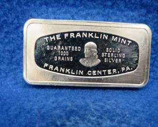 Lot 388. Franklin Mint Bank-marked sterling silver ingot. 65.23 grams.