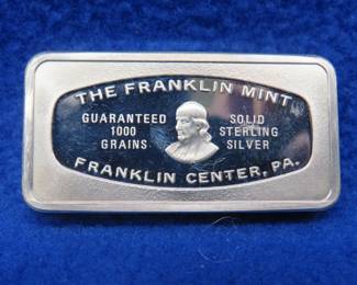 Lot 385. Franklin Mint Bank-marked sterling silver ingot. 65.41 grams.