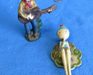 Lot 250. Cast iron door knocker and cast iron singing cowboy