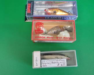 Lot 99. Rapala Glass Shad Rap, Heddon Tiny Runt 350 Xray, and an original Floating Rapala, all in boxes