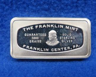 Lot 381. Franklin Mint Bank-marked sterling silver ingot. 65.55 grams.